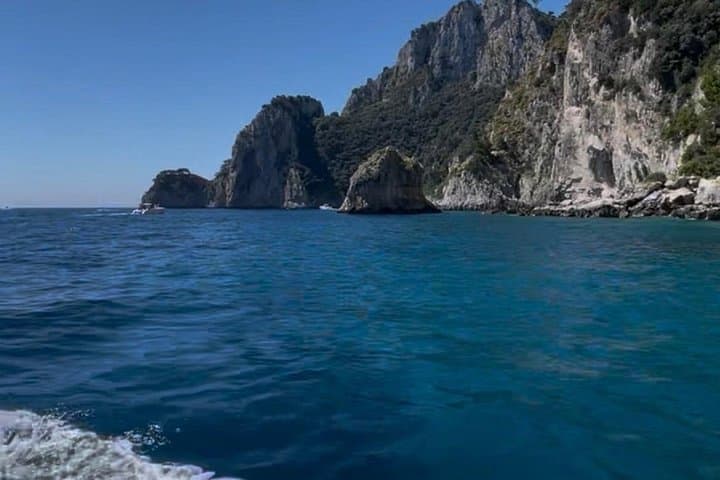 From Naples Boat trip to Capri visit to the city swim stop