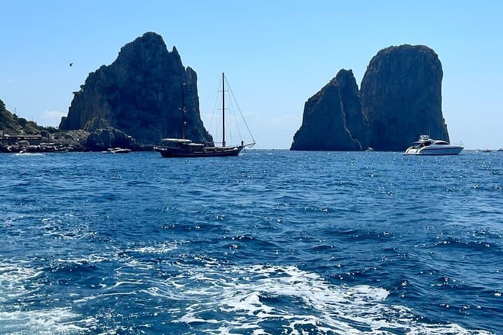 From Naples Boat trip to Capri visit to the city swim stop