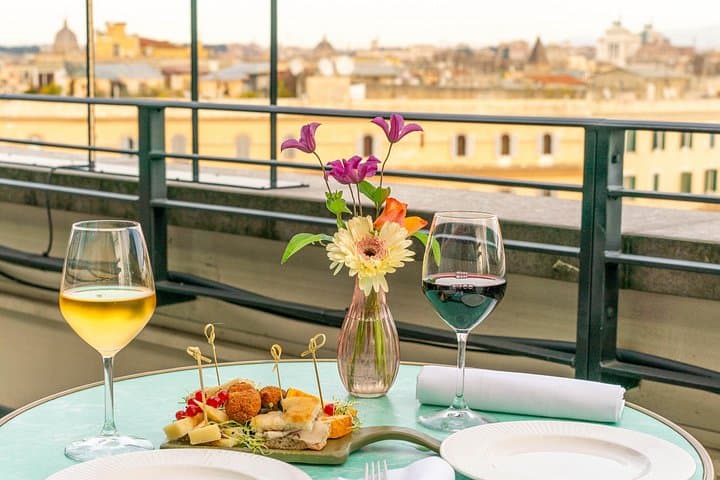 You will sit on one of the most exclusive rooftops of the iconic Trastevere