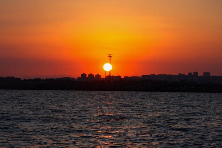 Aperitif on a sailing boat at sunset in Catania