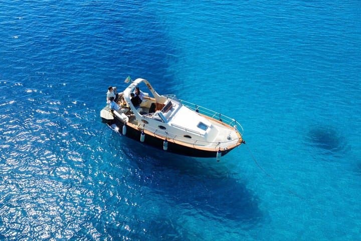 Experience in a typical gozzo between hidden coves and aperitif