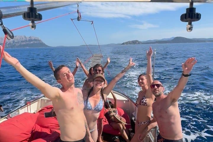 Golfo Aranci sunset on luxury yacht with dolphins and aperitif