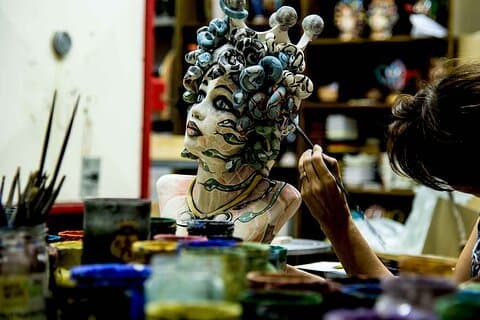 Brush in hand, mind in flow. Ceramic painting is where the magic continues. Painting of Medusa sculpture