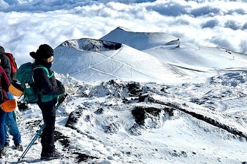 Hike near the summit craters up to the maximum safe altitude currently foreseen
