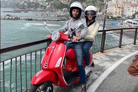 Customer with red vespa.