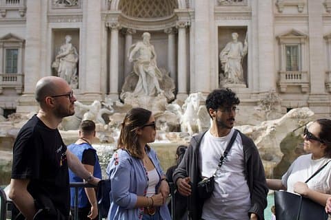 Toss a coin into the Trevi Fountain