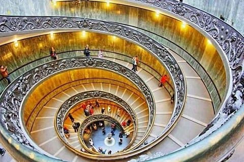 Marvel at the intricate spiral staircase of the Vatican Museums, a masterpiece of architectural design