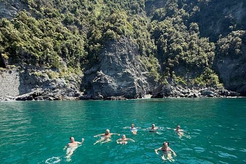 Boat ride from Riomaggiore with stop for swimming and local wine.