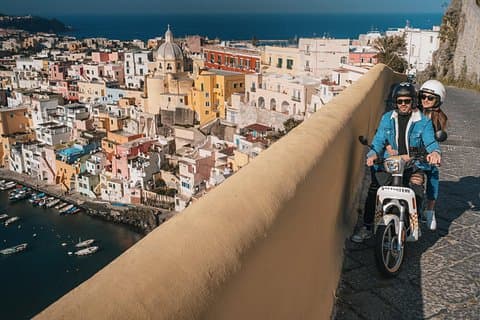 Live Procida sustainably with our silent electric scooters, perfect for exploring the island without emissions.