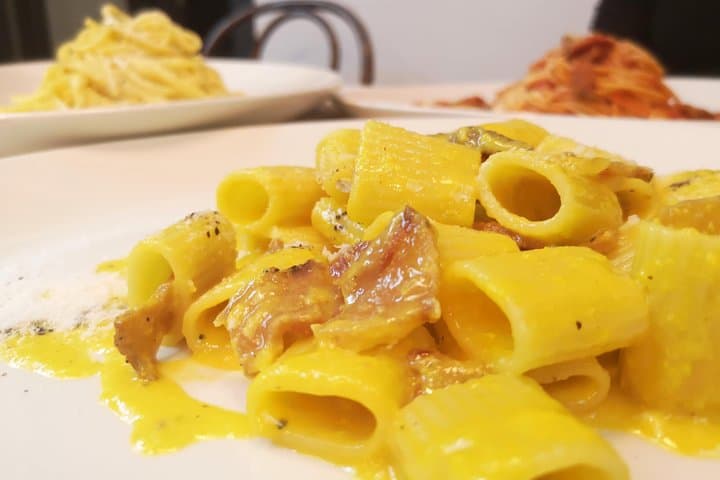 Pasta alla Carbonara is made with guanciale, pecorino cheese, egg, and black pepper