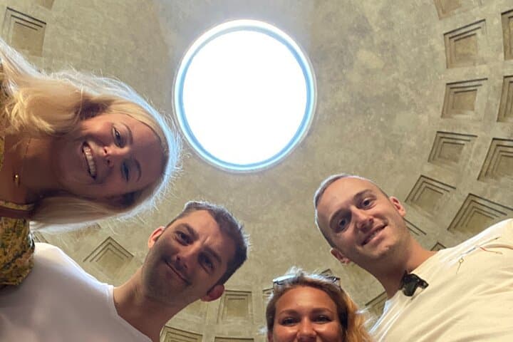 Four friends with the oculus above their heads
