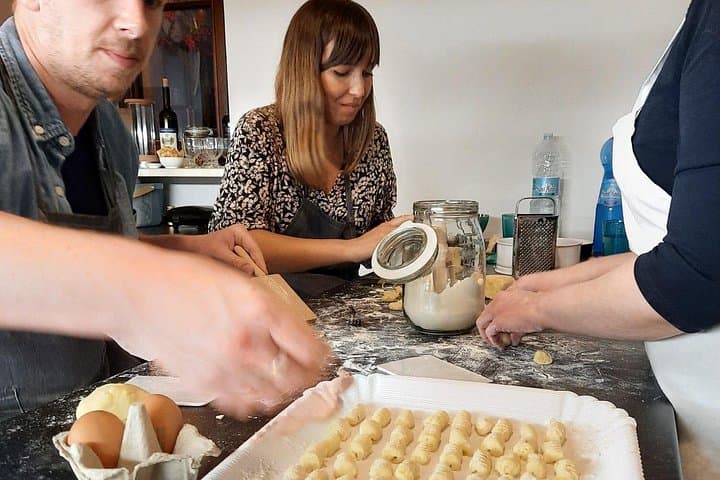 Sitting at the table to make gnocchi altogether