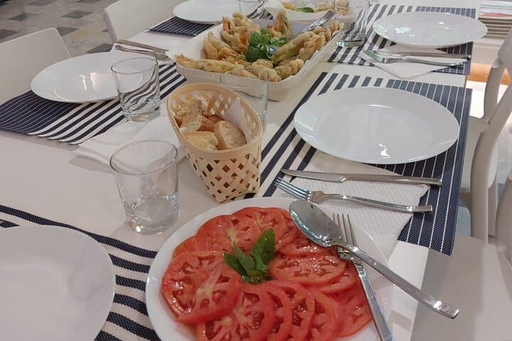 Fresh tomatoes salad, fried zucchine flowers stuffed with ricotta and mozzarella cheese