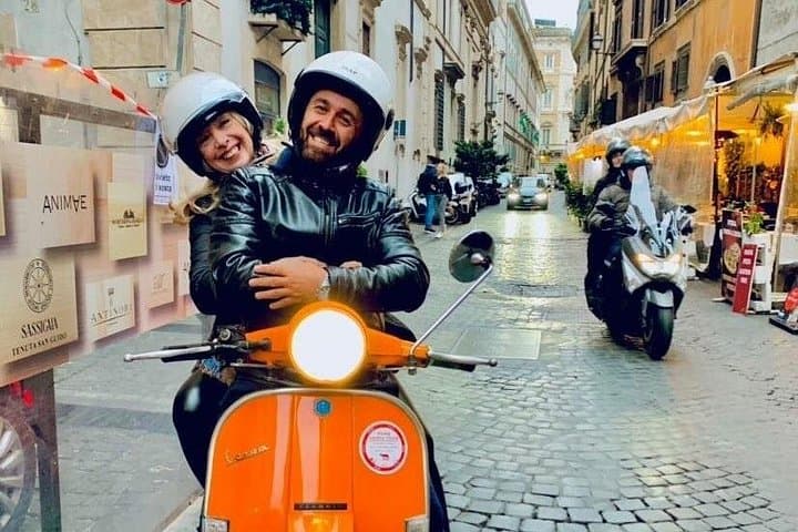 Ride Rome on a Vespa with a local driver