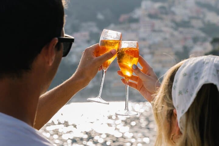 cheers at sunset in front of Positano