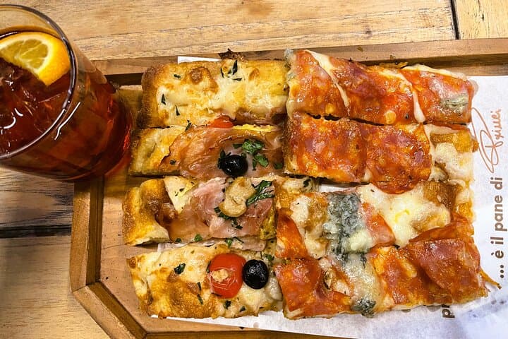 "Enjoy a delightful Italian aperitivo alongside mouthwatering pizza!"