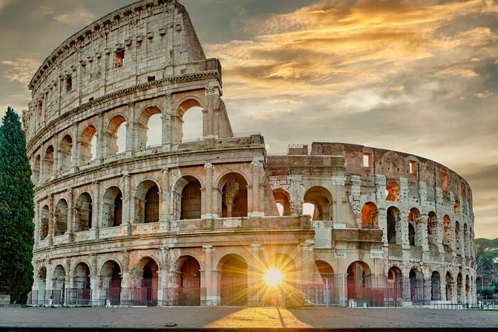 Colosseum Hosted Entry Included – Stunning exterior of the Colosseum at sunrise – Begin your Roman journey where gladiators once stood.