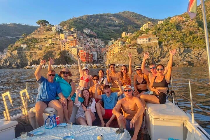 Cinque Terre sunset boat tour with a traditional ligurian gozzo