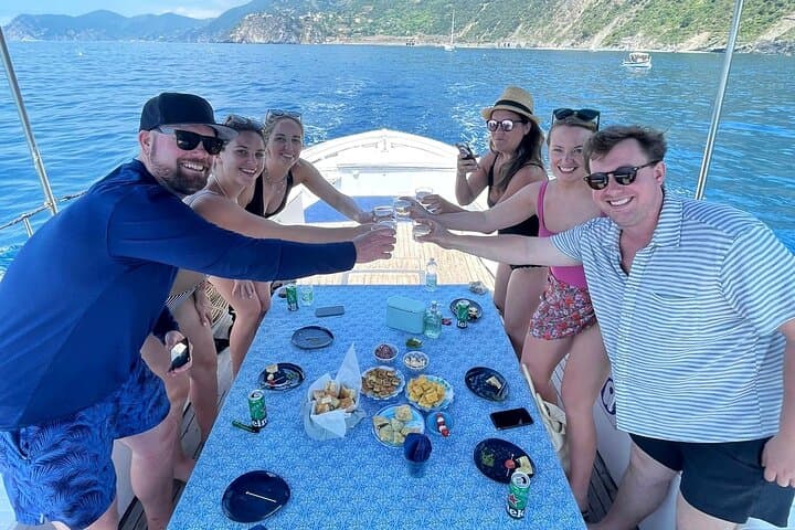 Cinque Terre daytime boat tour with a traditional ligurian gozzo