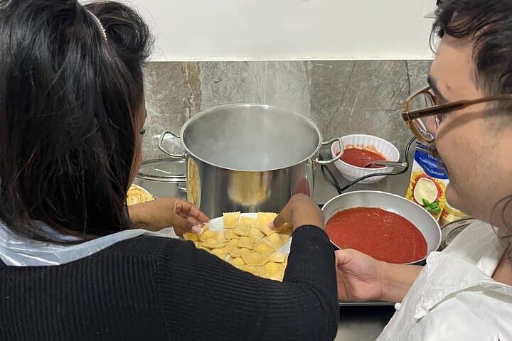Putting ravioli in boiling water.