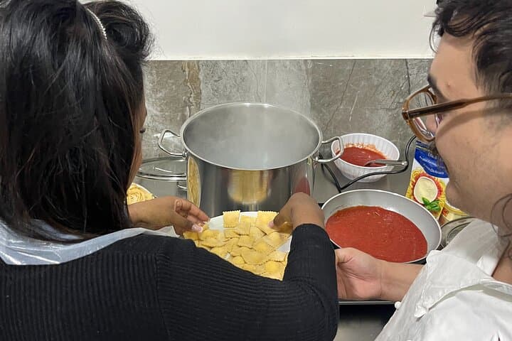 Putting ravioli in boiling water.
