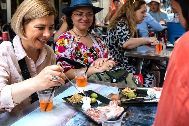 Aperitif time: spritz and a platter of mixed meat and cheese.