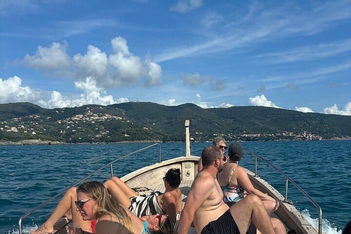 Boat ride from Riomaggiore with stop for swimming and local wine.