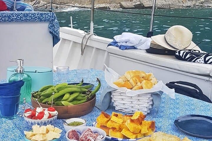 Cinque Terre daytime boat tour with a traditional ligurian gozzo