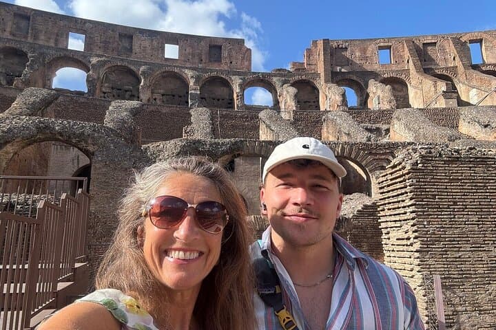 Happy couple taking selfie within Colosseum with Dream Tourism