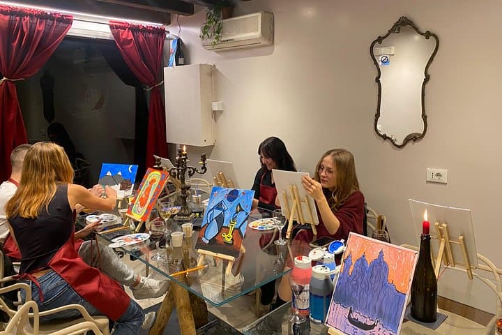 Guests painting together in our warm and inviting Venetian atelier, capturing a memorable evening
