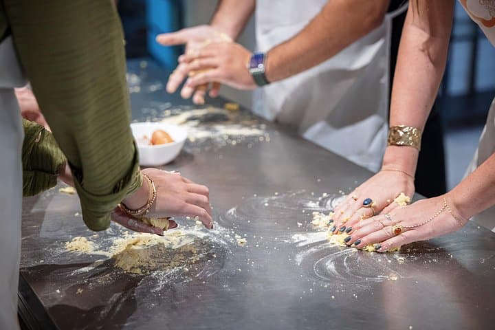 Hands shaping pasta