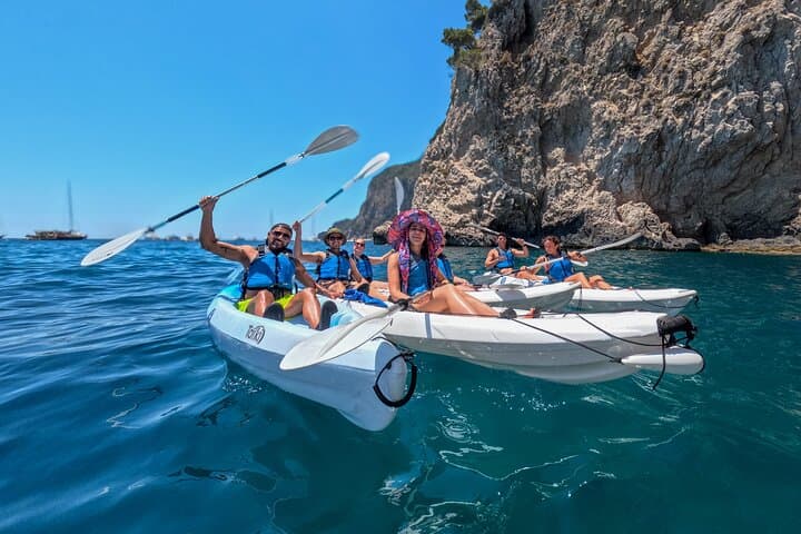 Kayaking on Capri between crystal clear waters and iconic Mediterranean rocks