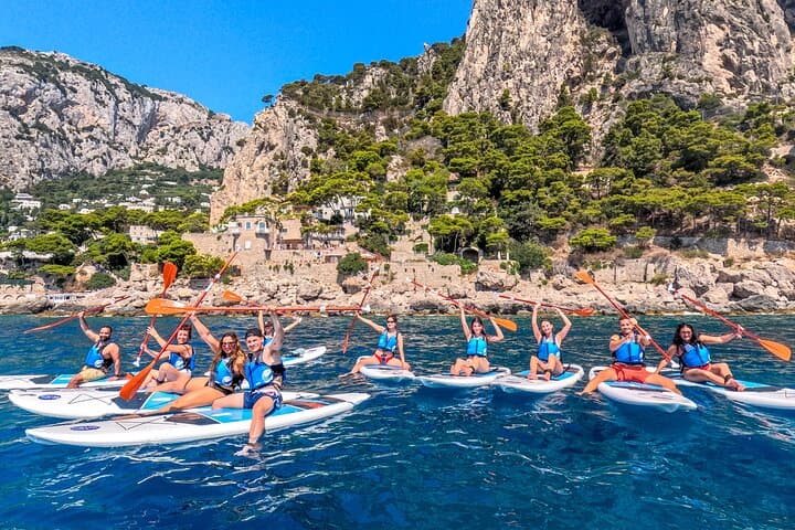 SUP experience in Capri among sea caves, rocky cliffs, and postcard-worthy coastal scenery.
