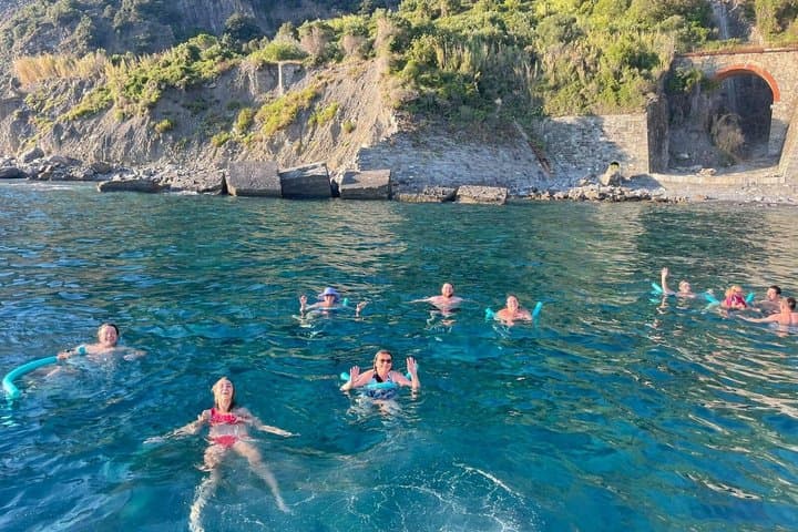 Cinque Terre sunset boat tour with a traditional ligurian gozzo