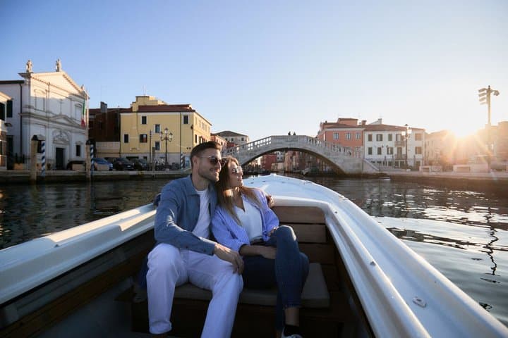 Iconic photo of a beautiful engaged couple in front of Ponte Vigo in Chioggia