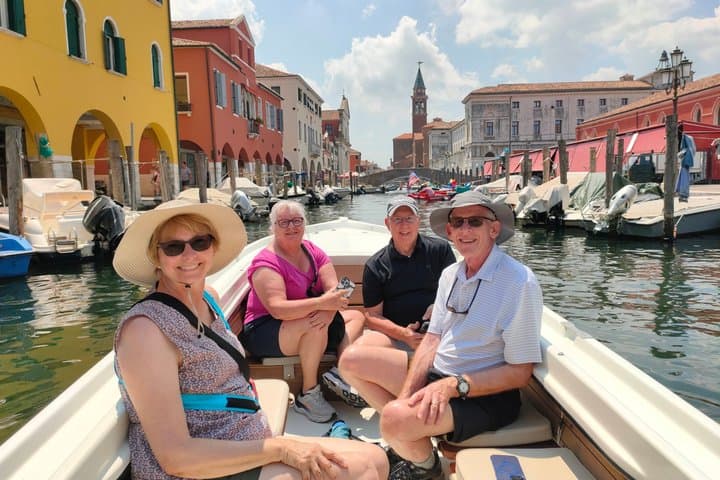 Group of American tourists during their boat trip to Chioggia to discover Little Venice