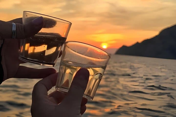 Cinque Terre sunset boat tour with a traditional ligurian gozzo