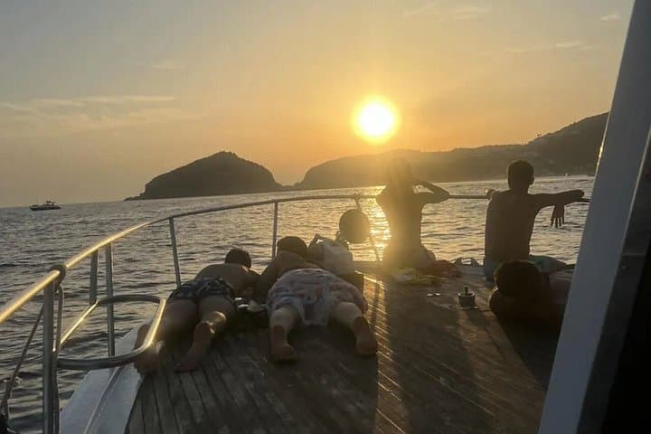 Sunset aperitif on the coast of Ischia by boat with skipper